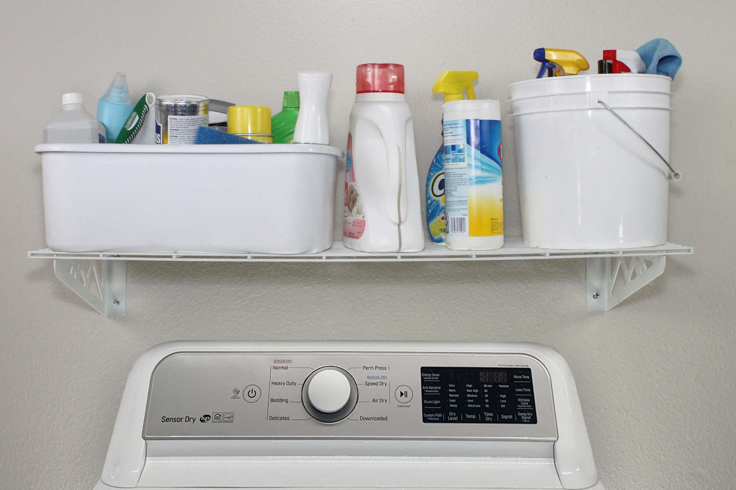 white wall shelf with detergent above washing machine