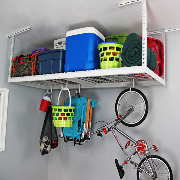 white overhead rack with bicycle and bins