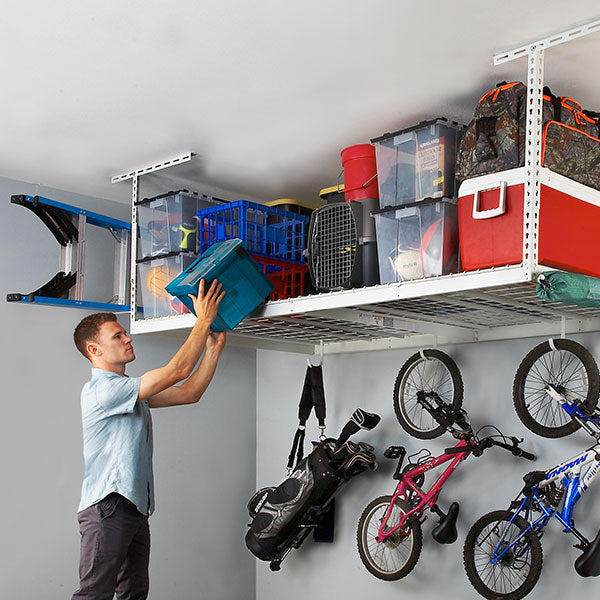 SafeRacks a person removing item from overhead garage rack